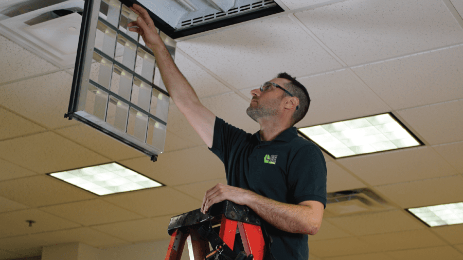 Lee Electrical Team Member Checking Lighting | Lee MechanicalElectrical Home