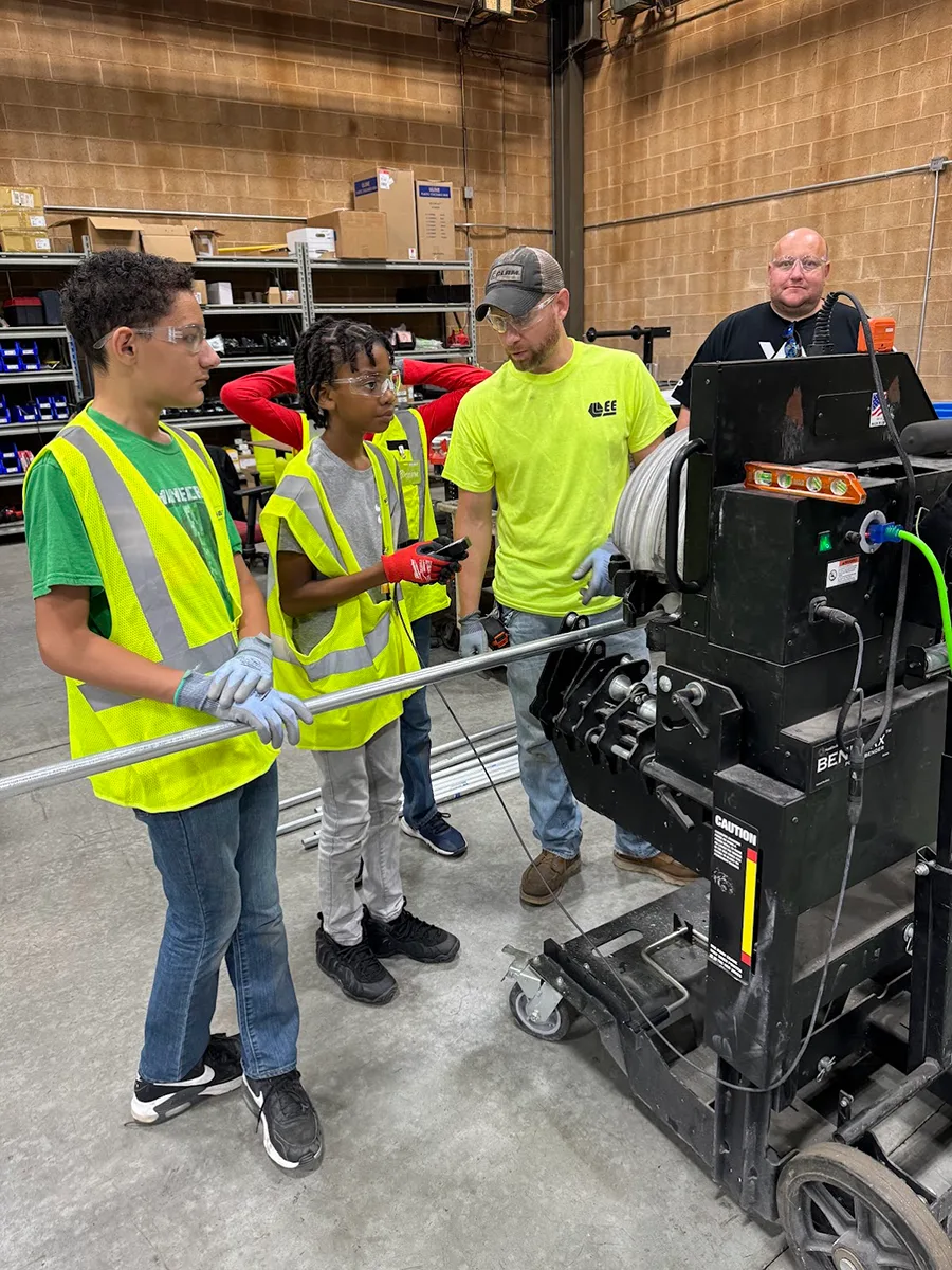 KUSD Students working with Lee Employees on machinery in their Franklin, WI facility. KUSD Students working with Lee Employees on machinery in their Franklin, WI facility.
