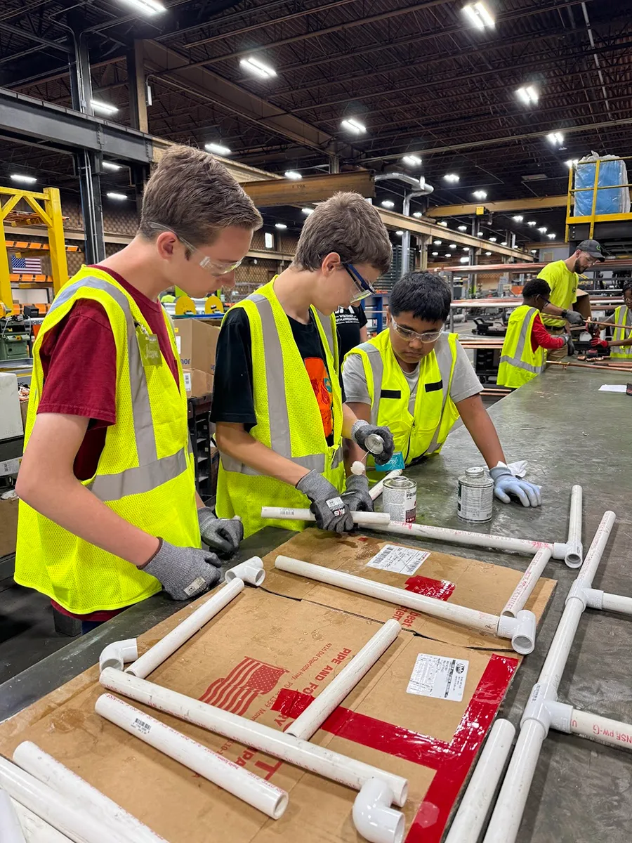 KUSD Students working on PVC pipes. KUSD Students working on PVC pipes.